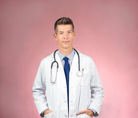 Handsome young doctor in white coat, stethoscope around neck, tie and shirt