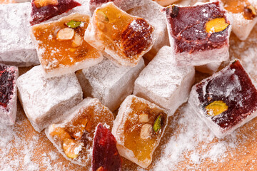 Sweet food Turkish delight, assorted rahat locum in form of cubes with nuts and powdered sugar, traditional food