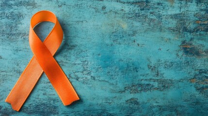 Orange awareness ribbon on teal background