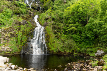 Obraz premium Assaranca Waterfall, one of Donegal's most beautiful waterfalls. Hidden gem that must-see for tourists visiting the region. Stunning natural attraction near Maghera Beach and Caves.
