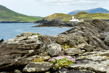 Beautiful view of Valentia Island Lighthouse at Cromwell Point. Locations worth visiting on the Wild Atlantic Way. Scenic Irish countryside on summer day, County Kerry, Ireland.