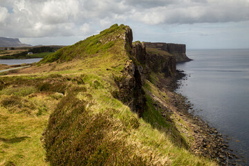 The grassy landscape of Scotland’s Isle of Skye meets the Atlantic Ocean via its dramatic cliffs.