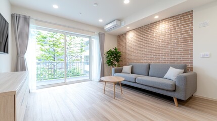 Modern apartment living room, balcony view, brick wall, light wood floor. Ideal for real estate listings