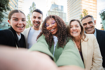 Joyful Group of Business People or Friends Smiling Together and Having Fun Shooting a Selfie...