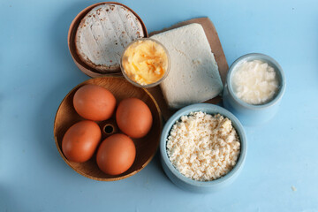 set of dairy products on a blue background