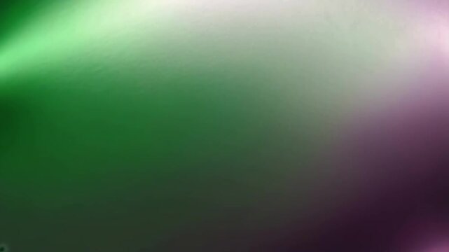 A blurry green and purple background with a green line. The background is a mix of green and purple, creating a sense of depth and movement. The green line adds a sense of energy