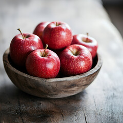 Juicy red apples in a rustic wooden bowl. A healthy and delicious snack, perfect for any occasion.