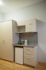 kitchen corner with a refrigerator and an electric stove
