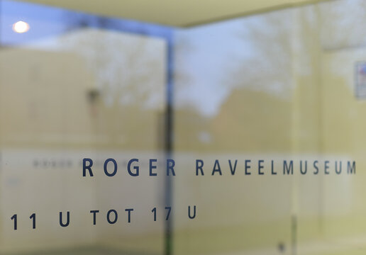 ZULTE, BELGIUM &ndash; JANUARY 22, 2025: Glass entrance door with black lettering in the Museum Roger Raveel, a Flemish post expressionist and popart artist who died in 2013. Selective focus
