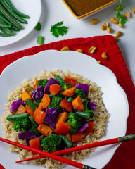 Healthy broccoli salad and jasmine rice dish, featuring vibrant green broccoli, white rice, and colorful baby carrots. Perfect for food blogs, menus, and healthy eating concepts.