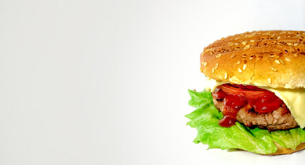 Appetizing homemade burger with lettuce, sesame bun, slice of cheese and tomato, juicy beef patty on a clean white background, banner
