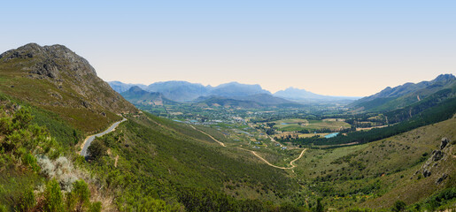 Naklejka premium Panorama shot of Franschhoek Valley surrounded by mountains, Franschhoek, South Africa