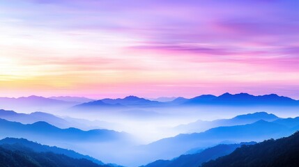 Obraz premium Colorful sunrise over misty mountain range, peaceful landscape, ideal for travel brochures