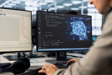 Fototapeta premium Engineer doing data center automation using AI and machine learning tools. IT professional integrating artificial intelligence driven automation in server farm operations