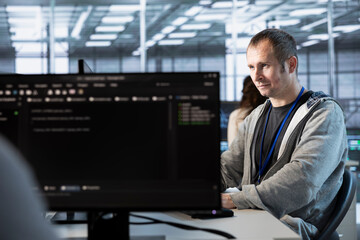 Computer scientist in data center managing and optimizing IT infrastructure using network...
