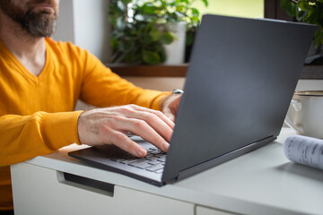 casual businessman working on a laptop