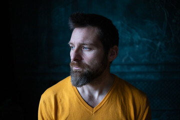 Obraz premium handsome man portrait on a dark background