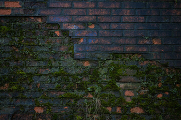 Old crumbling red brick wall