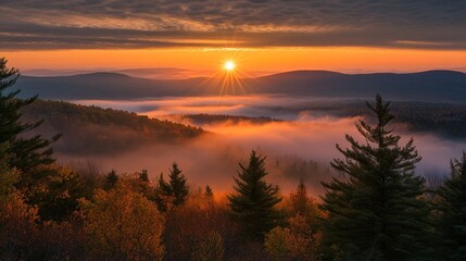 Fototapeta premium Autumn Sunrise Over Misty Mountains