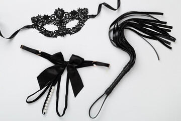 Set of erotic BDSM accessories on color background, top view