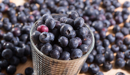 Juicy fresh blueberries on wooden table