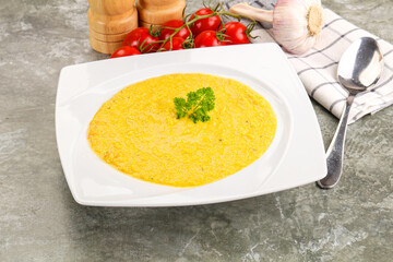 Vegetarian corn cream soup served parsley