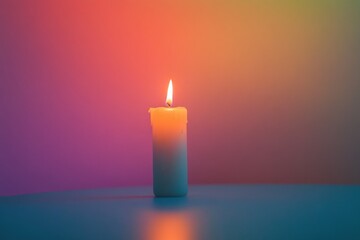 Lit candle on table, colorful backdrop, peaceful scene, meditation
