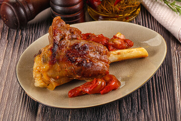 Baked lamb shank with vegetables