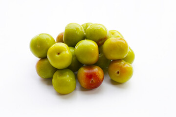 Fresh green plum on white background
