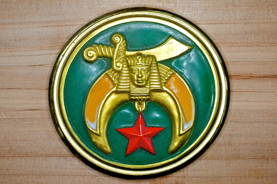 Logo for Shriners International. Mystical symbols in emblem with Middle Eastern-inspired iconography