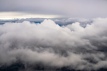 Clouds cover the sky in various shades of gray, creating a serene atmosphere during the early morning hours