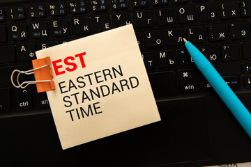 Toy forklift hold letter block t to complete word est (abbreviation of established, estimated