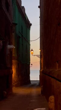 narrow street in the old town in taranto apulia italy