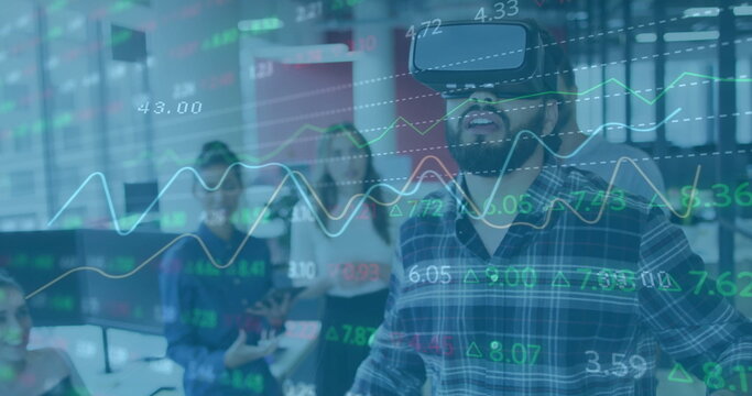 Image of financial data processing over biracial businessman using vr set
