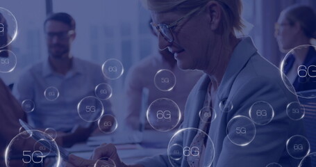 Image of 6g texts over caucasian businesswoman using tablet