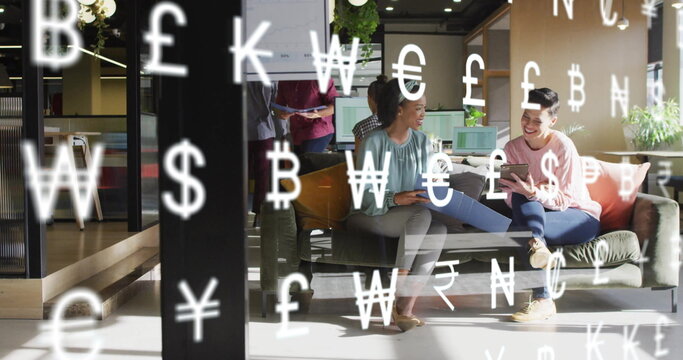 Image of currency symbols and data processing over diverse business people in office - Powered by Adobe