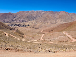 Winding dirt road through the desert mountains of northern Argentina