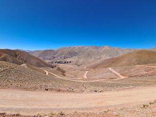 Winding dirt road through the desert mountains of northern Argentina