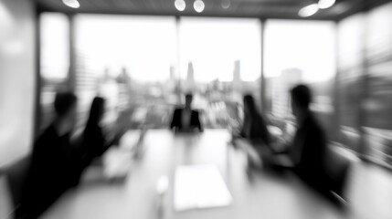 Blurred image of business people in meeting.