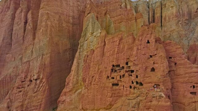 Cave Dwellings With Prayer Flags Preserved In Upper Mustang's Cliffs
