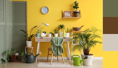 Interior of room with green plants, table and watering cans. Different color patterns