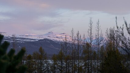 Cloud cover mountains in the middle of Tundra landscape in scenic Iceland countryside.