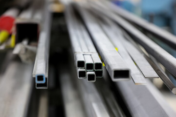 Close up shot of color coded metal tubes for raw material of building construction.