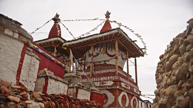 Ancient Tibetan Gompa In Lo Manthang With Fluttering Prayer Flags