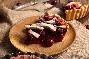 Plate with piece of tasty cherry pie, closeup