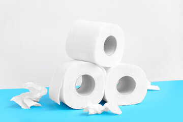 Rolls of toilet paper on blue background