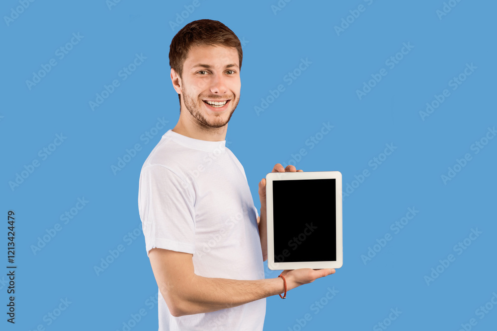 Poster cool application concept. smiling man holding tablet, showing black blank screen, empty space, mock 