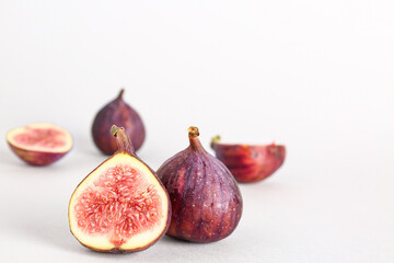 Fresh ripe figs on white background