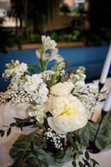 Elegant white rose bouquet decorations at wedding reception