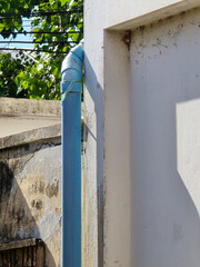 white wall with a pvc water tube